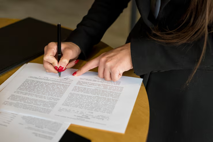 brunette-businesswoman-writing-document_23-2148142696